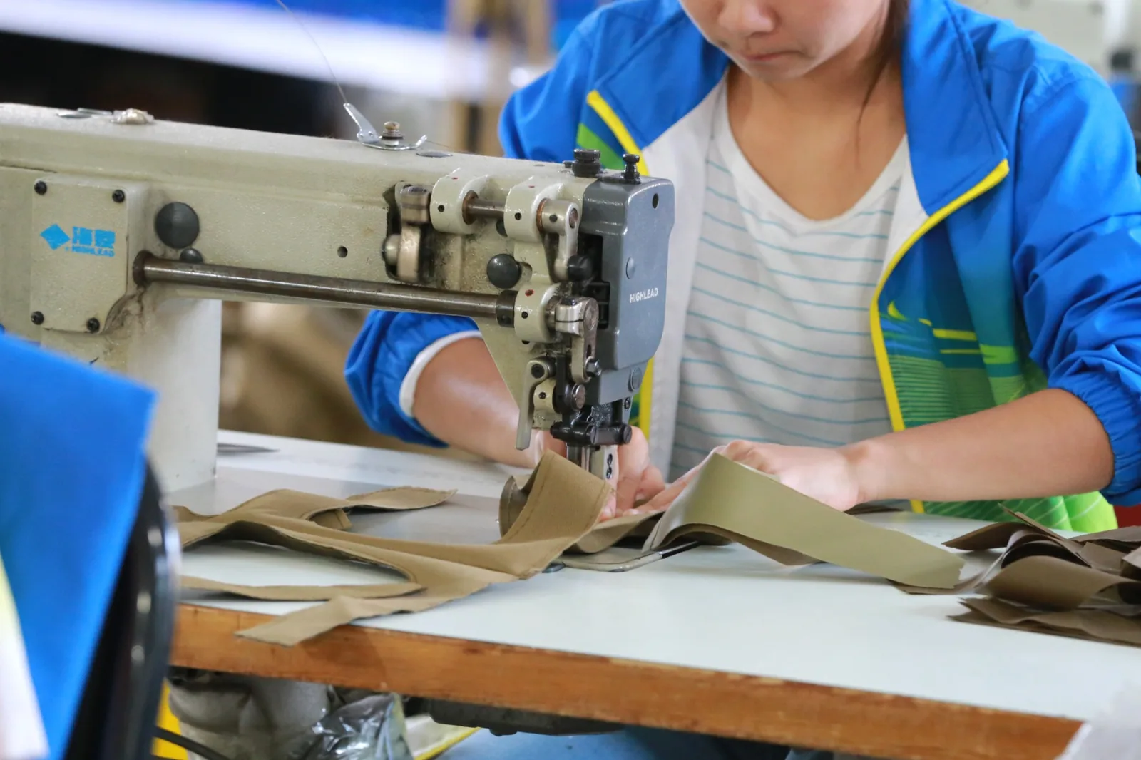 Backpack panel sewing at a Baigou production station